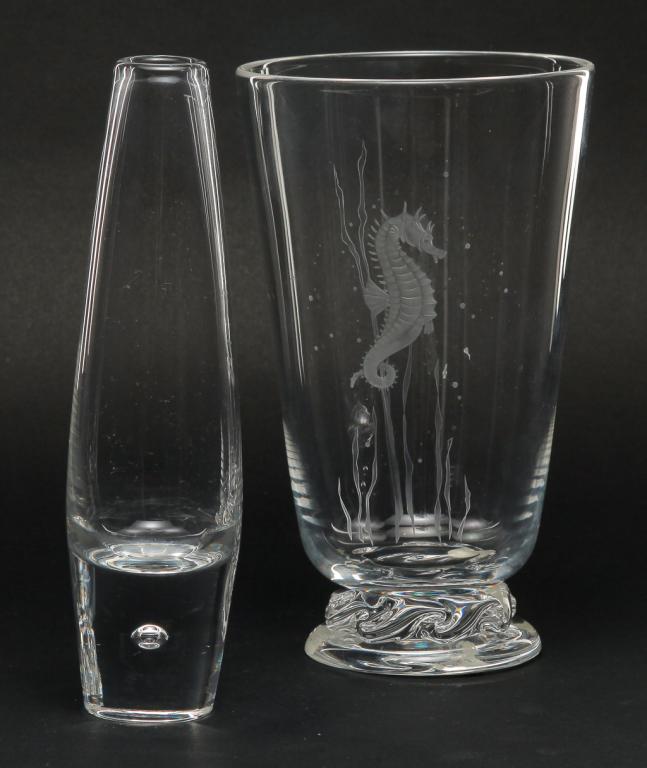 TWO AMERICAN STEUBEN VASES.: Late 20th century. Signed. One with canted sides, applied foot with tooled stem and etched seahorse, 7.5"h. And a bud vase with tear drop base.