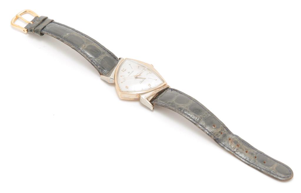 HAMILTON ELECTRIC PACER WRISTWATCH, CIRCA 1960.: American, ca. 1960. Hamilton Watch Co., Lancaster, Penn., electric "Pacer" wrist watch, caliber 500, battery operated (needs new battery), 2-tone 10K gold filled asymmetric case, leather band.