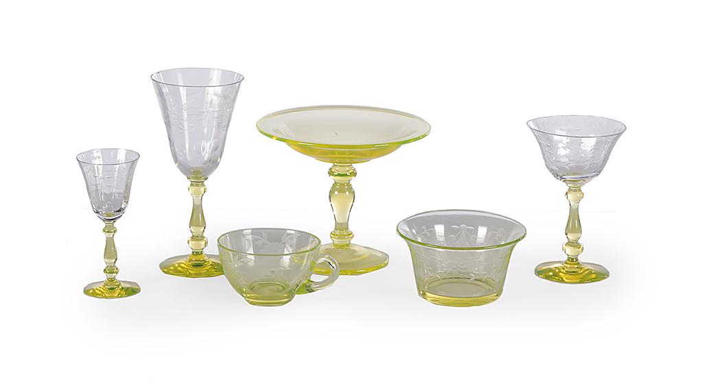 GROUP OF ENGRAVED VASELINE STEMWARE.: American, 20th century. Eight cups, bowl, 2.5"Âh. 4.5"Âd., six cordials, 5"ÂÂh., seven glasses, 7.25"Âh., seven wines, 5.75"Âh. And a mismatched tazza, 5.25"ÂÂh. Minor roughness.