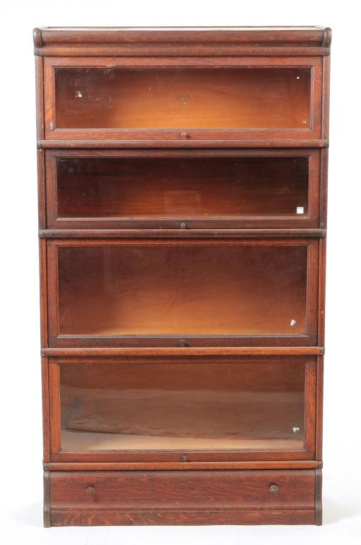 FOUR SECTION STACKING OAK BOOKCASE. (1 of 4)