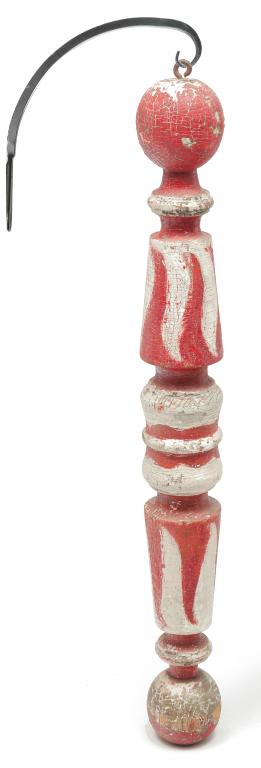 AMERICAN TATTOO SHOP POLE.: Late 19th-early 20th century. Turned wood with layers of red and white paint over traces of gold and blue. Flame design. Alligatored, flaking paint. 32"l. not including modern hanger. From the Collect