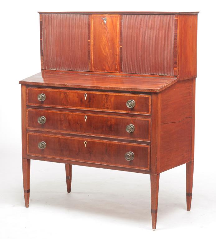 AMERICAN HEPPLEWHITE LADIES SECRETARY.: Late 18th-early 19th century, mahogany with pine secondary. Two piece with matching banded inlay and diamond escutcheons. Base has high tapered feet, three dovetailed drawers with applied beading and 