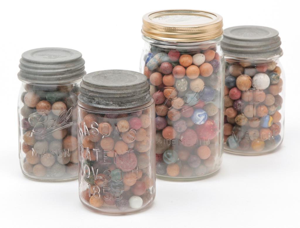 FOUR JARS OF AMERICAN MARBLES. (1 of 2)