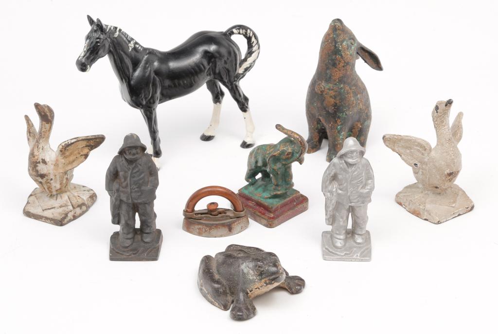 NINE AMERICAN CAST METAL FIGURES. (1 of 5)