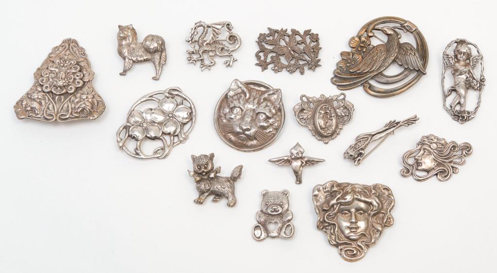 FIFTEEN ANTIQUE STYLE STERLING SILVER BROOCHES. (1 of 3)