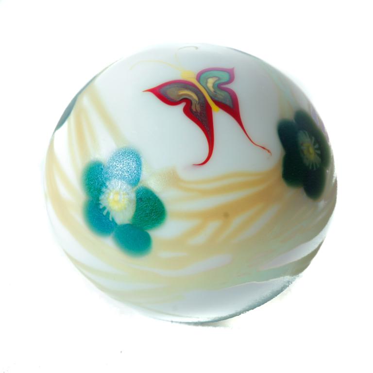 SIGNED LOETZ IRIDIZED PAPERWEIGHT.: Australia, late 20th century. Amethyst cased in white with red butterfly, green flowers and gold threading. 2.5"h. 3"dia.