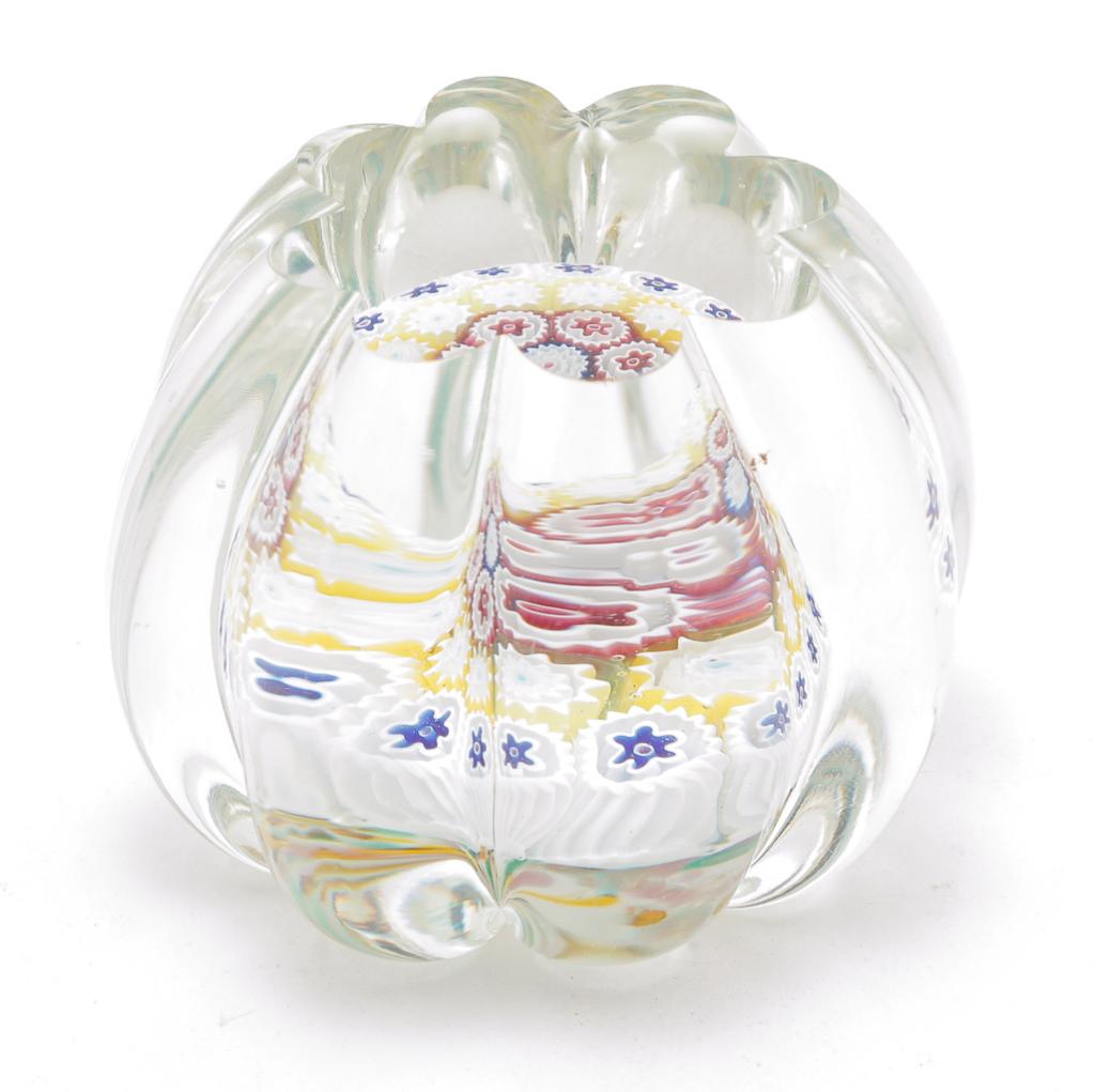 EUROPEAN MILLEFLEUR PAPERWEIGHT.: Late 20th century. Multicolored interior canes with melon ribbed clear body with table cut top and base. 3"d.
