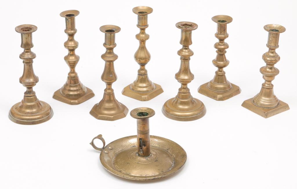 EIGHT ENGLISH VICTORIAN BRASS CANDLESTICKS. (1 of 3)