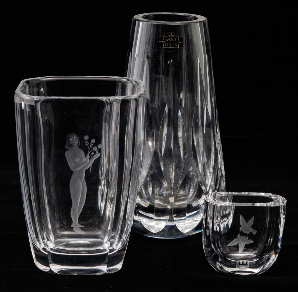 THREE EUROPEAN CRYSTAL GLASS VASES.: Late 20th century. Signed. French Saint Louis cut vase, 10"h., Swedish Orrefors with etched female nude also signed "Palmquist, 73325 R. 632", 7.75"h. and Swedish Kosta with etched birds, also numbere