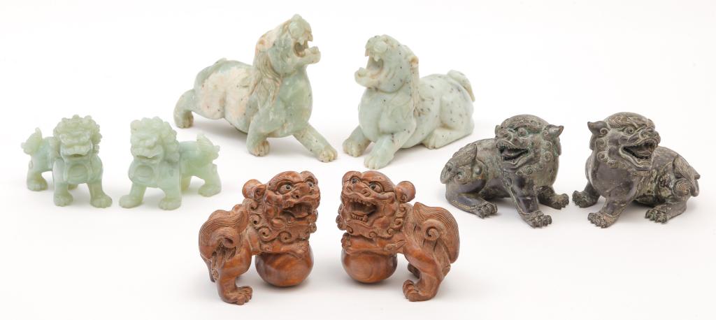 EIGHT ASIAN CARVED LIONS AND FOO DOGS. (1 of 2)
