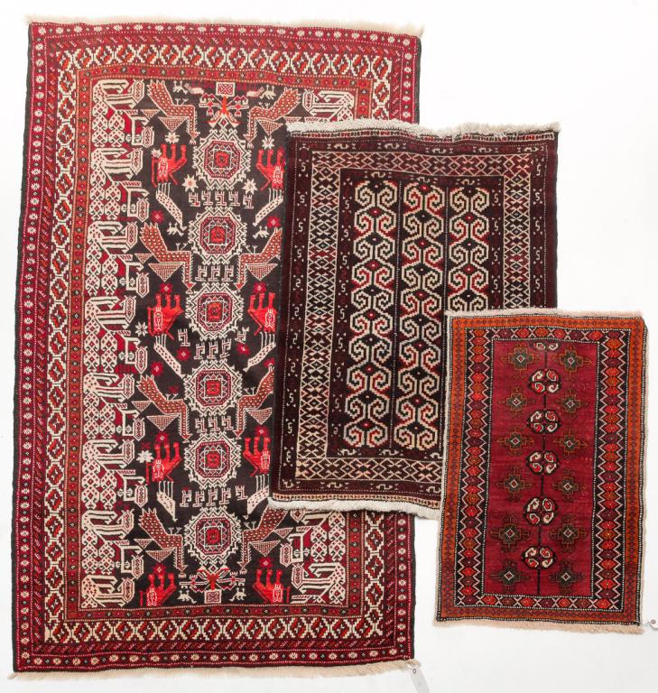 THREE ORIENTAL RUGS. (1 of 4)