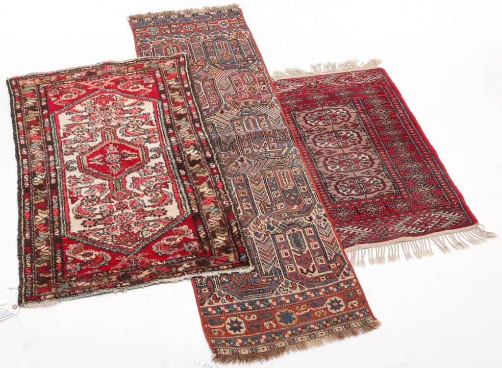 THREE ORIENTAL RUGS. (1 of 4)