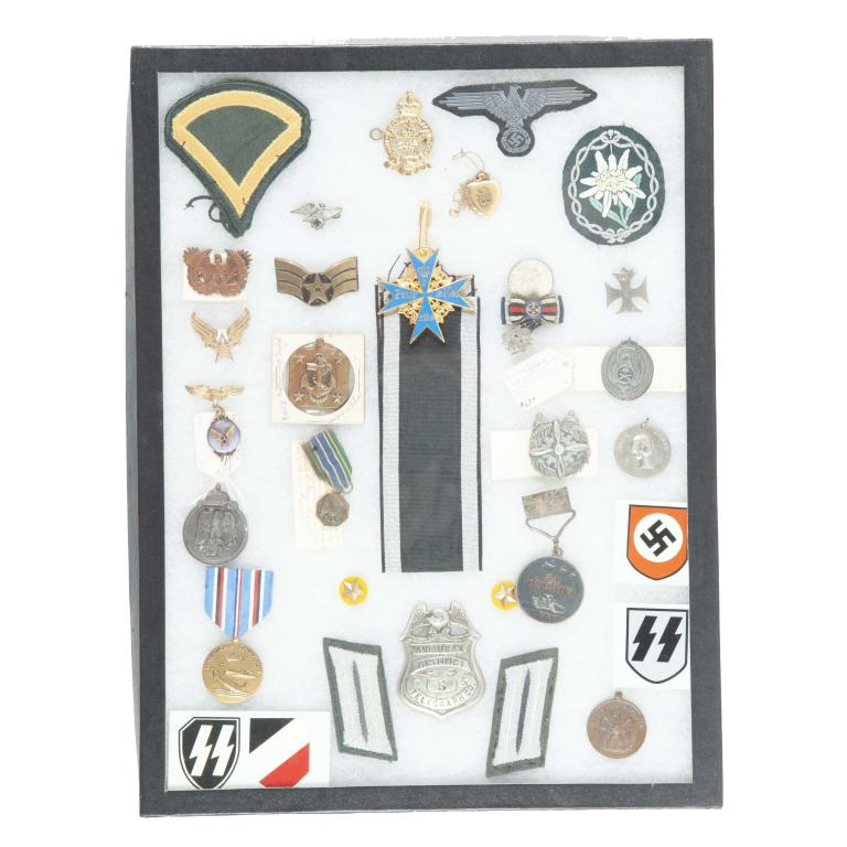 RICKER MOUNT OF VARIOUS MEDALS, PATCHES, AND PINS.: RICKER MOUNT OF VARIOUS MEDALS, PATCHES, AND PINS. Includes an American District Telegraph Company badge, German WW2 memorabilia, and American Military medals.