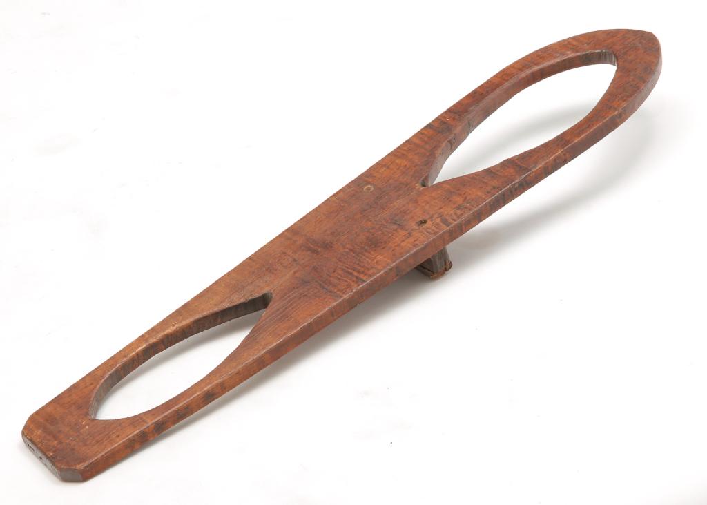 AMERICAN COUNTRY BOOTJACK.: Second half 19th century, maple with some curl. One piece simple form. Age splits. 33"l. 6.5"w.