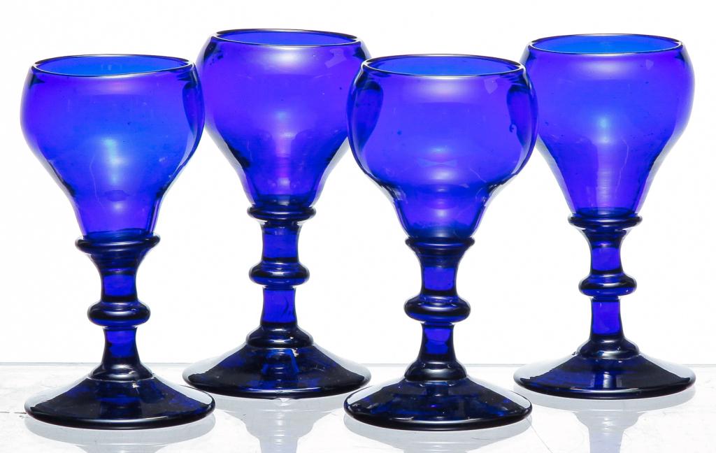 FOUR BLOWN COBALT GLASS CORDIALS.: Probably American, 2nd half-19th century. 3.5"h. From the collection of the late Chris Powell and Christine Powell, Zoar, Ohio.
