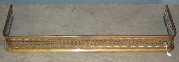 TWO FIREPLACE ITEMS. Small brass fender