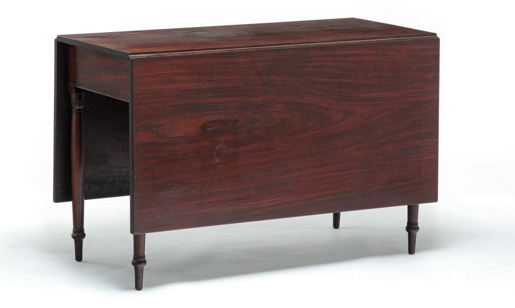 AMERICAN SHERATON DROP LEAF TABLE.: First quarter 19th century, mahogany with ash and pine secondary. One board top and leaves, apron with beaded edge and slender turned legs, two of which swing to support leaves. Refinished with some s