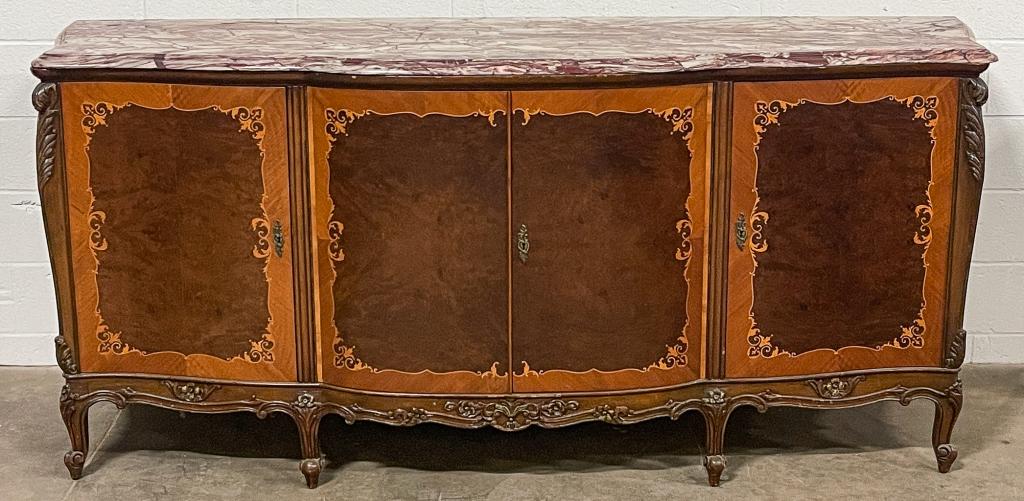 EUROPEAN INLAID MARBLE TOP SIDEBOARD.: Second quarter 20th century, mahogany. Red and tan veined marble with routed edge, shaped ends and front, carved legs, front corners and apron, and banded blonde mahogany, burled panels and floral sap