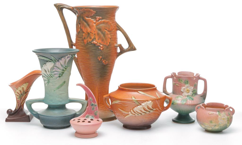 SEVEN PIECES OF ROSEVILLE ART POTTERY.: Second quarter 20th century. Three pieces of Freesia, green vase, 9.5"h. and tan and brown cornucopia vase, 6.25"h. and square vase, 5"h. Two pieces of White Rose, footed vase, 6.25"h. and squat vase,