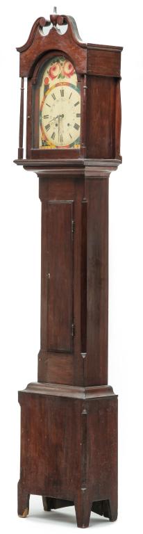 AMERICAN HEPPLEWHITE TALL CASE CLOCK.: First quarter 19th century, cherry with wormy chestnut secondary. Bonnet with broken neck arch pediment, turned finial, arched door and slender turned pilasters. Case with lamb's tongue chamfered corn