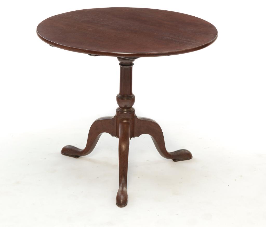 ENGLISH QUEEN ANNE TILT-TOP TEA TABLE.: Late 18th century, mahogany. Round, two-board top, primitive birdcage, turned urn base column and curved legs with pad feet. 27"h. 30.5"d.