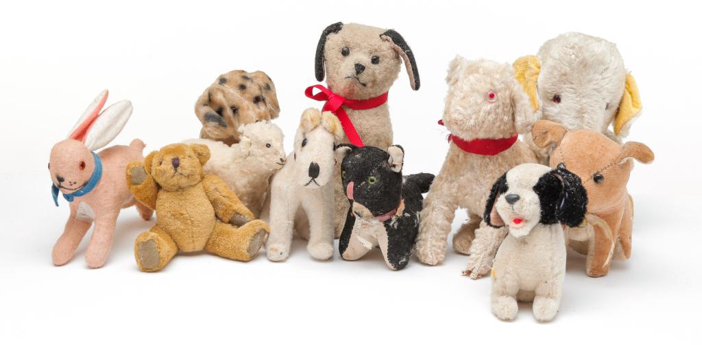 GROUP OF STUFFED ANIMALS AND FIGURES.: American, European and Japanese, 20th century. Includes cloth, mohair, plush and wool covered. Sheep, dogs, teddy bears, donkey and rabbits including one labeled "Germany". Varying condition.