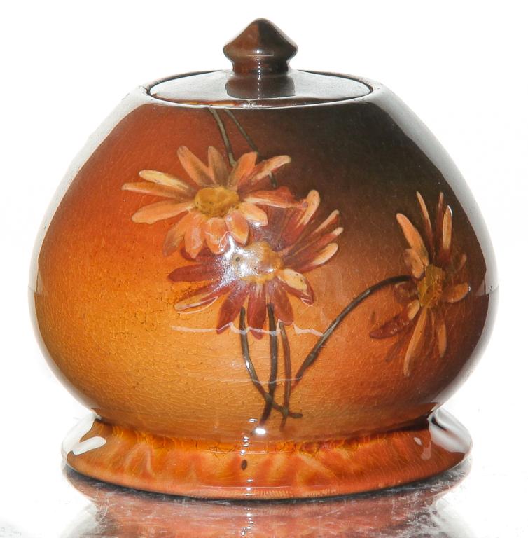 ROCKWOOD STANDARD GLAZE INKWELL BY EDWARD ABEL.: Dated 1890. Shape number 586B with daisy decoration. Signed on bottom. Minor wear on table ring and chip on insert. 2.75" h