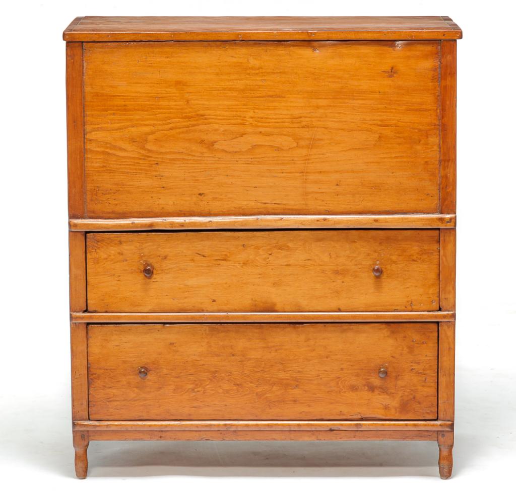 AMERICAN COUNTRY SHERATON MULE CHEST.: Second quarter 19th century, pine. Lid with applied edge molding, solid ends, corner posts with short turned legs, two dovetailed drawers and mortised and square nail construction. Refinished with age