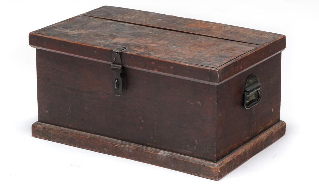 AMERICAN DIMINUTIVE TOOL CHEST.: Fourth quarter 19th century, walnut with pine secondary. Applied moldings on lid and base, interior with two sliding trays and iron bale handles. Old worn finish and age split on lid. 11"h. 21.75"w. 1