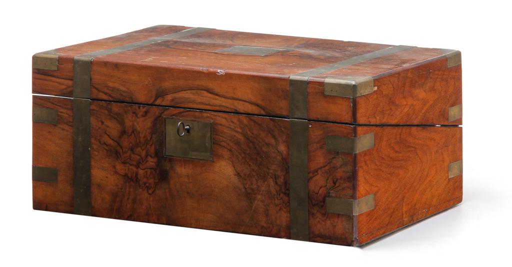 ENGLISH LAP DESK.: Fourth quarter 19th century, burled English walnut over mahogany. Brass bound. Fitted interior with three hidden drawers and engraved plate "Presented to MA Raben, Feb. 21st, 1877". Refinished, replac