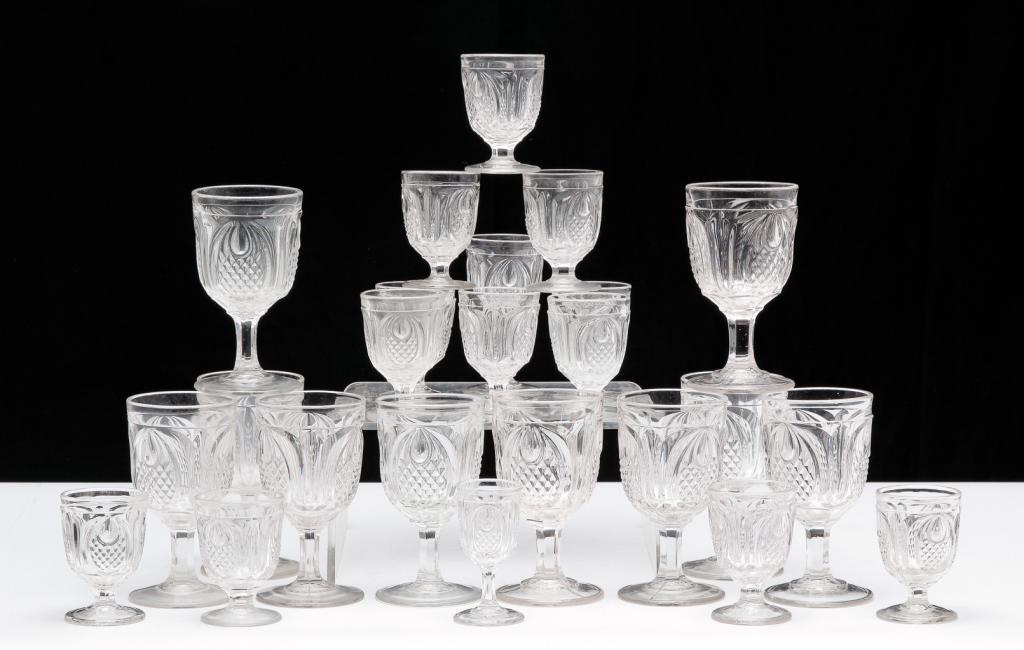 THIRTY PIECES OF "NEW ENGLAND PINEAPPLE" GLASS.: American, mid 19th century. Clear flint glass pattern by Boston & Sandwich Glass Co. Fifteen goblets, 6"h., thirteen egg cups, 3.75"h., a wine, 5.25"h. and a cordial, 4"H.