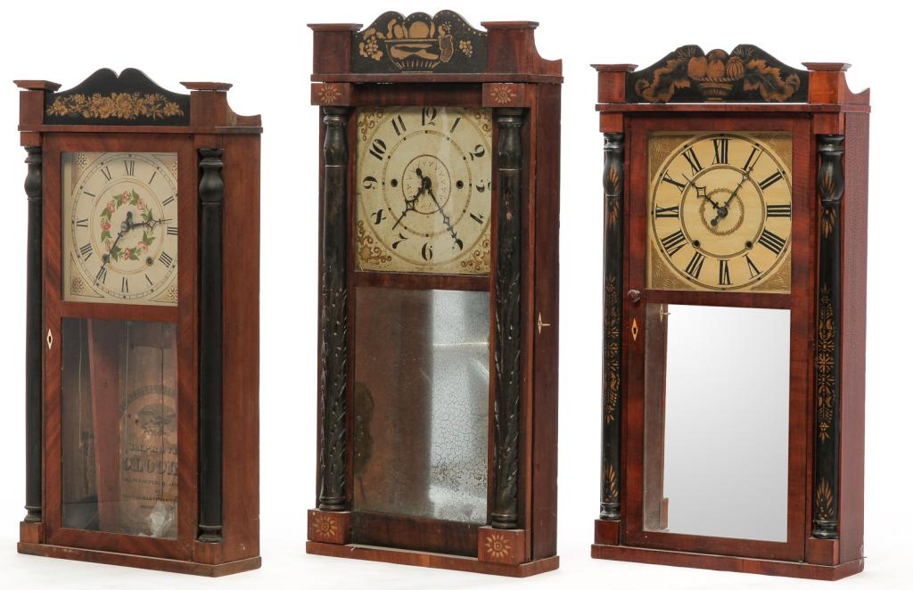 THREE AMERICAN MANTEL CLOCKS.: Second quarter 19th century, mahogany veneer. All have stenciled crests, worn paper labels and applied half pilasters. Two by "Jerome & Darrow". Taller has replaced crest and stenciled elements, repla