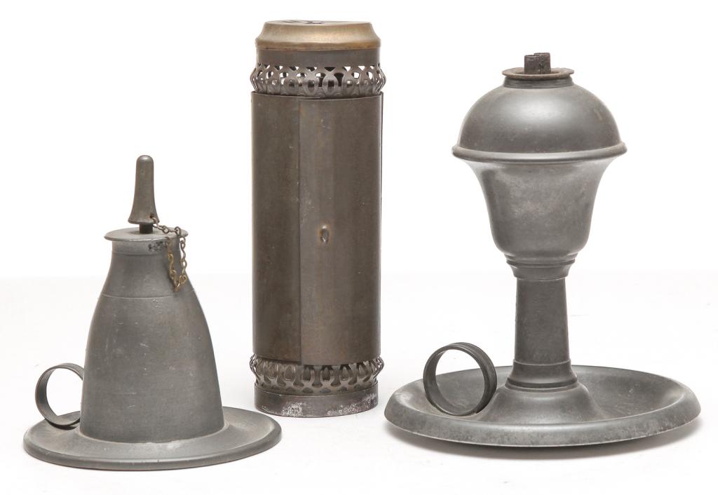 THREE PIECES OF AMERICAN LIGHTING.: Mid 19th century. Two pewter whale oil lamps. "Capen & Molineux, NY" single burner with snuff cap, saucer base and finger ring. 4.5"h., and double burner, tapered stem, saucer base and finger ring. To