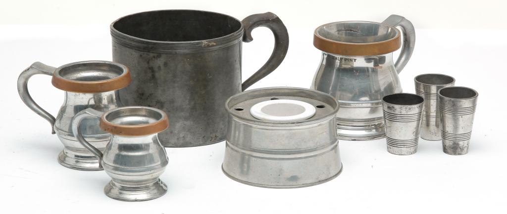 SEVEN PIECES OF PEWTER.: Nineteenth century. Three Victorian bellied measures with brass rims, an inkwell with ironstone insert, mush mug and three measures (shots?), two marked "6", one marked "5".
