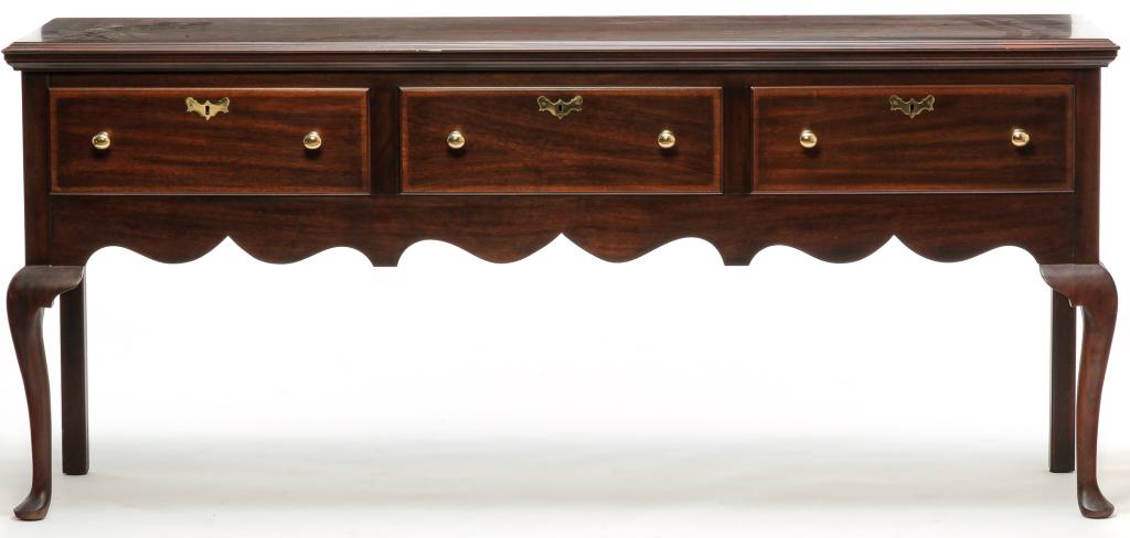 HENKEL-HARRIS QUEEN ANNE STYLE SIDEBOARD.: Second half 20th century, mahogany with oak secondary. Virginia Galleries line. Top with routed edge, three overlapping dovetailed drawers, scalloped ends and apron, cabriole legs with pad feet. 34"h.
