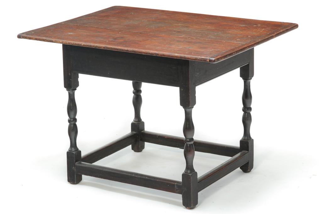 AMERICAN TAVERN TABLE.: Ca. 1800, pine. Two board top with breadboard ends, hardwood base, apron with beaded edge, turned legs, stretcher with beaded edge and pegged construction. Refinished, age split and patch on top. 25.5
