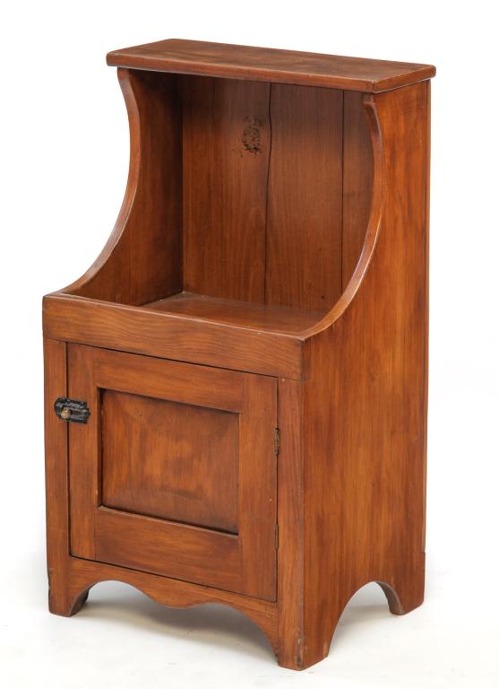 AMERICAN CHILDS SIZE DRY SINK.: Twentieth century. Constructed from old pine lumber. Hutch back with top shelf, solid end with simple cut outs, lower chamfered single panel door and shaped apron. Some edge wear and splits, heavily r