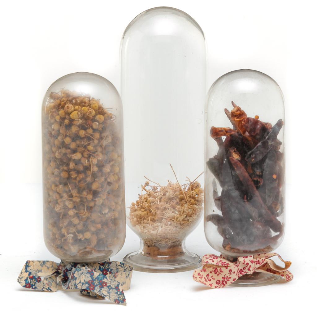 THREE AMERICAN FLINT GLASS APOTHECARY BOTTLES.: Second half 19th century. Narrow necks with flared lip and rounded ends. One 8.25"h. and two 6.5"h.