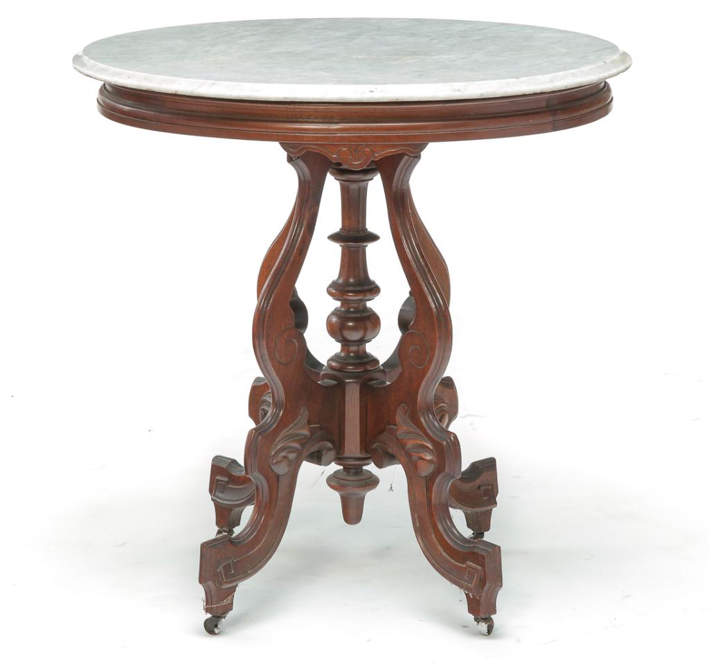 AMERICAN VICTORIAN MARBLE TOP PARLOR TABLE.: Third quarter 19th century, walnut. White veined marble, top frame with routed edge, curved legs with incised and applied carvings and center turned column. Base is loose. 30"h. 29.5"w. 21.5"d.