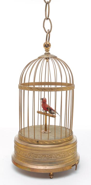 GERMAN BIRDCAGE AUTOMATON.: Mid 20th century. Brass wire and die stamped cage with red bird on perch. 13"h. overall.