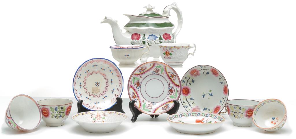 SEVEN PIECES OF ENGLISH CHINA.: First half 19th century. An Adam's Rose teapot, 7"h., three handleless cups and saucers, two handled cups and saucers with pink luster trim and one handleless cup. Some stains, and handleless cup and 