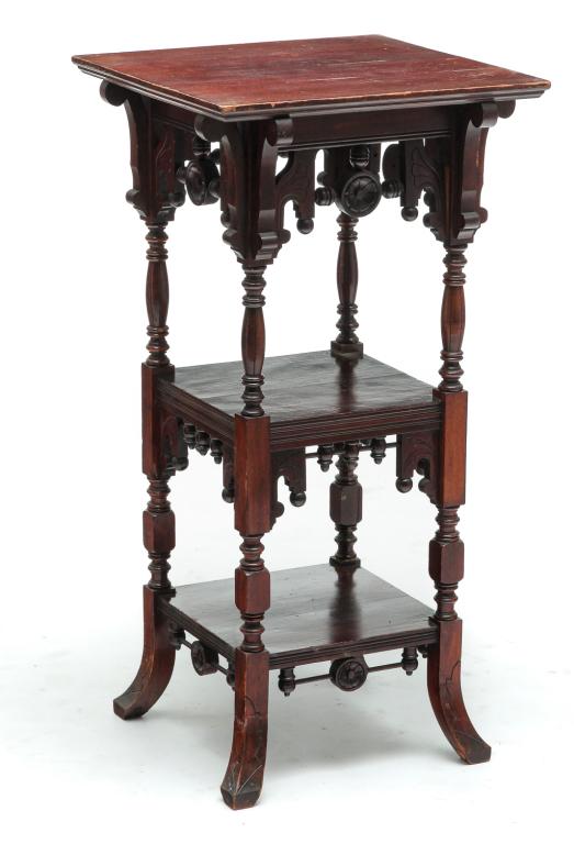 AMERICAN EASTLAKE VICTORIAN FERN STAND.: Fourth quarter 19th century, southern gum. Stick and ball adornments with floral and line carvings, turned legs, two lower shelves and splayed legs. Finish wear. 35.75"h. 18"w. 17.5"d.