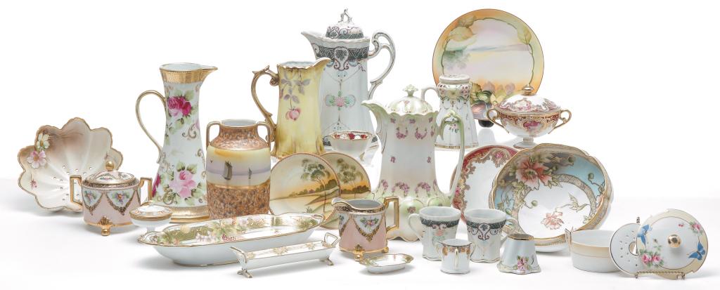 GROUP OF JAPANESE NIPPON CHINA.: Twentieth century. Included are footed bowls, colander, ewer, muffineer, creamer and sugar, chocolate pot, relish dish, butter dish, sugar cube holder, toothpick holders, bullion cup and saucer, nut d