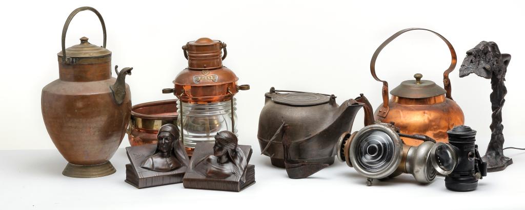 GROUP OF METAL WARE.: Nineteenth-20th century. Includes tin whale oil lamp, cast iron kettle, contemporary ship lights, grease lamp, copper kerosene lamp with milk glass shade, "Dante" bookends and more.