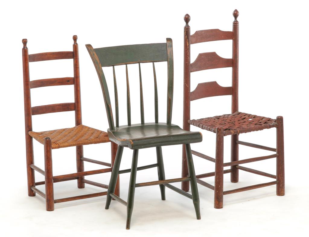 THREE AMERICAN COUNTRY CHAIRS.: First half 19th century. Rabbit-ear Windsor seat, worn green paint with traces of black stenciling, 17" seat. 33.5"h. And two ladderbacks: mixed woods including maple and oak, with old, worn red paint