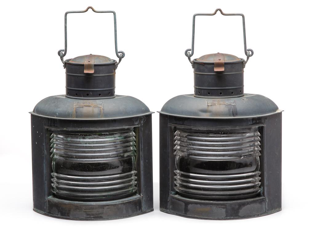 PAIR OF AMERICAN SHIP RUNNING LIGHTS.: Mid 20th century. Brass and copper with clear lenses "Port" and "Starboard". Missing burners and lenses were originally reverse painted red and green. 18"h. plus handles.