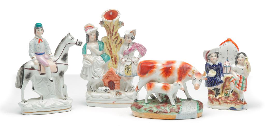 FOUR ENGLISH STAFFORDSHIRE FIGURES.: Third quarter 19th century. Spill vase with man and woman and a rabbit at their feet, 8.25"h., young man astride a dappled horse, 7.25"h. and two children flanking a clock set at 6:00. 5.75"h. Togethe