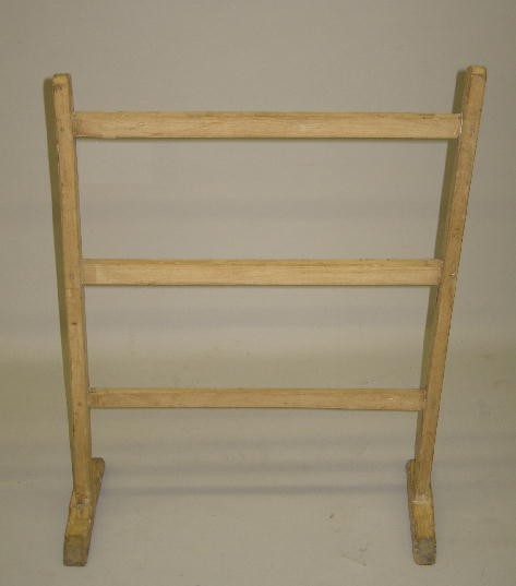 SMALL HERB DRYING RACK. Hickory and pine with an o: SMALL HERB DRYING RACK. Hickory and pine with an old cream colored wash. Mortised construction with shoe feet and three cross members. Small split on one foot and loose joints. 28"h. 20 1/2"w.