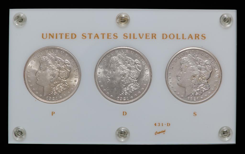 THREE 1921 MORGAN SILVER DOLLARS IN CAPITAL CASE (1 of 2)