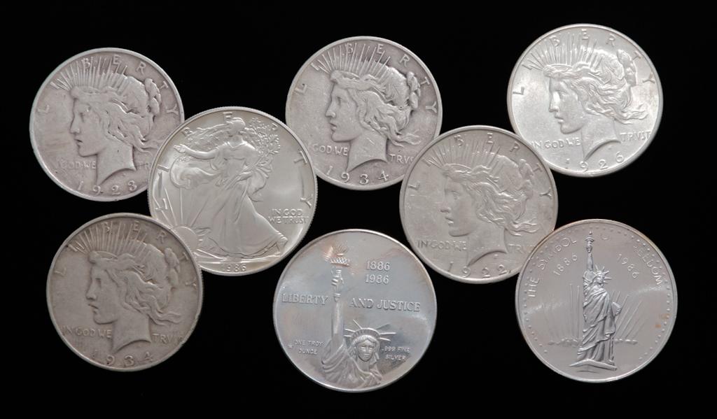 SIX SILVER DOLLARS AND TWO SILVER ROUNDS (1 of 2)